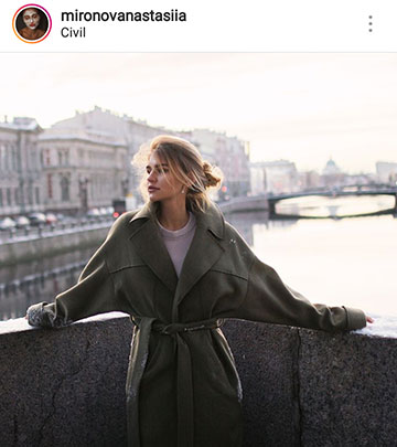 ideias de fotos de outono para instagram - uma garota em uma ponte com um casaco